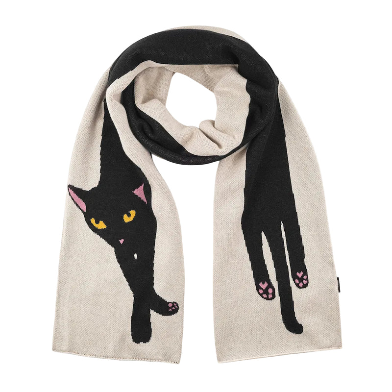 A knitted scarf in beige and black, featuring a large black cat design on one side and a black hand with pink paw pads on the other, shown against a white background.