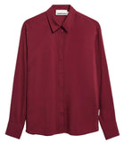A long-sleeve button-up shirt in a deep burgundy color, featuring a classic pointed collar and a small white brand label on the left sleeve cuff.