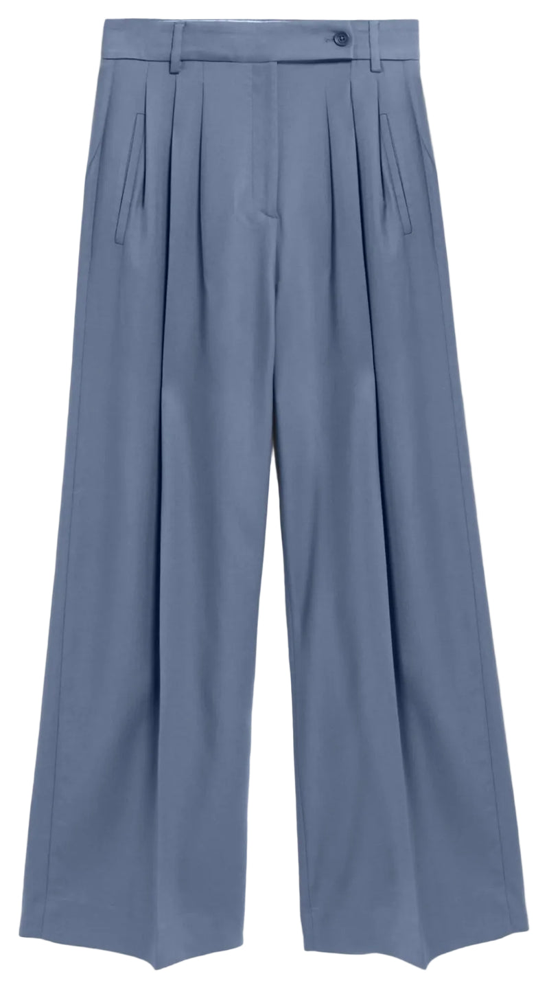 A pair of high-waisted, wide-leg trousers in a dusty slate blue color, featuring pleated detailing down the front and a matching fabric belt, shown against a white background.