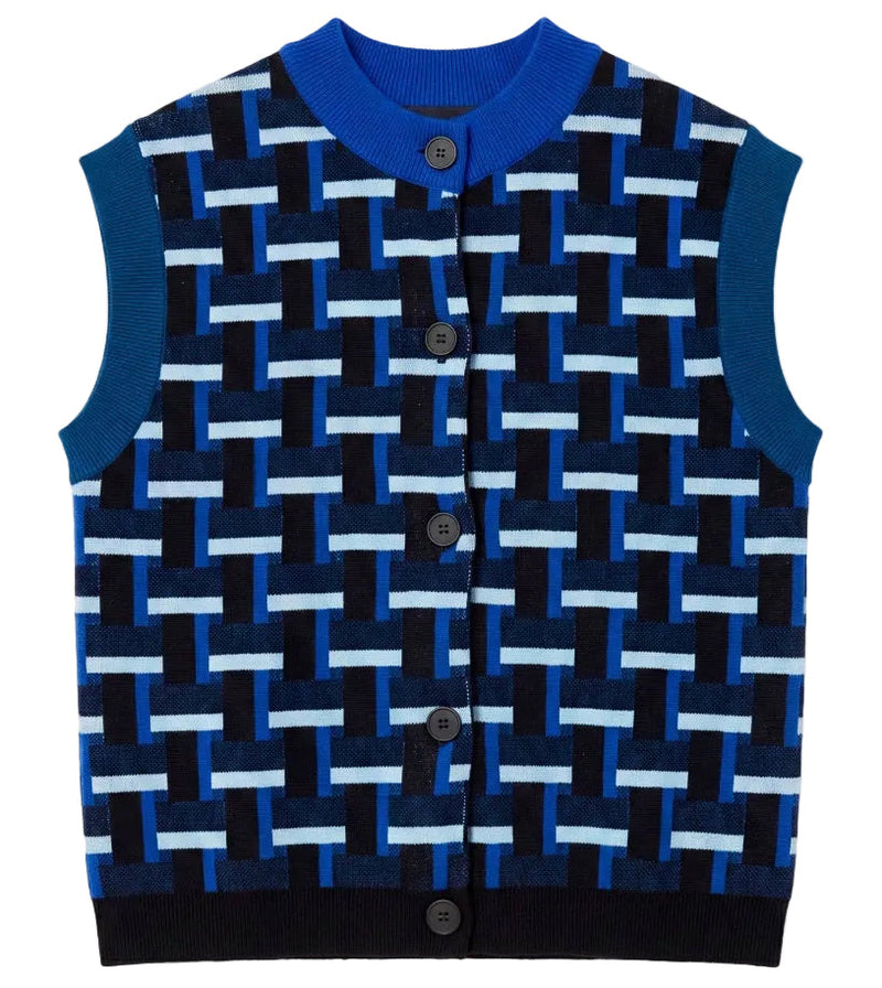 A sleeveless knit cardigan vest with a geometric interlocking pattern in navy, royal blue, and light blue, featuring a solid blue ribbed collar and cuffs, and a button closure.