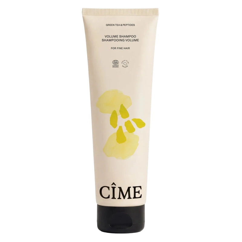 Cîme shampoo tube with a yellow label on a white background
