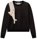 A black knit crewneck sweater featuring a large graphic of a white cat hanging from the shoulder, shown against a white background.