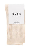 Beige sock with KLUE label on a white background