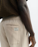 THINKING MU Light travel pants oatmeal men