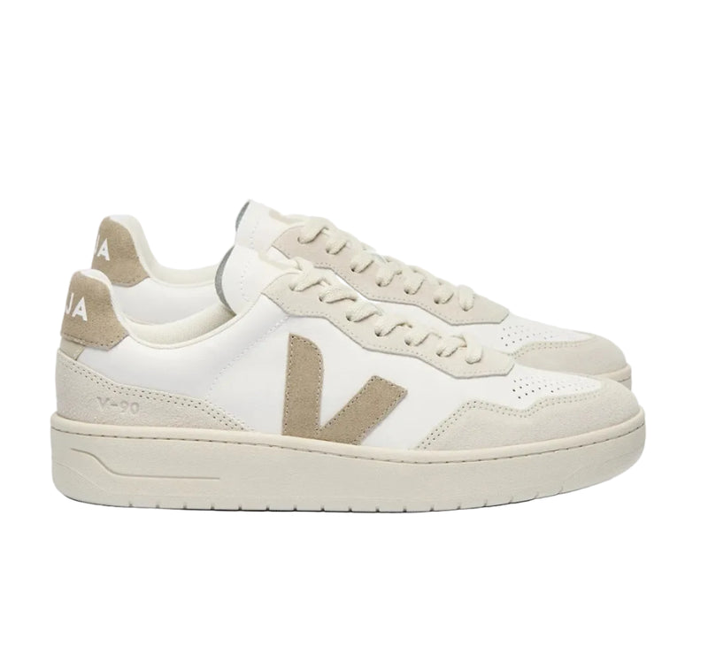 White and beige sneaker with brand logo on a white background