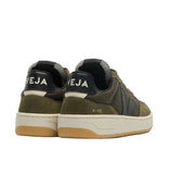 A pair of low-top sneakers shown from the back, featuring olive green suede and mesh panels, a black heel tab with 'VEJA' in white text, a cream midsole, and a gum outsole.